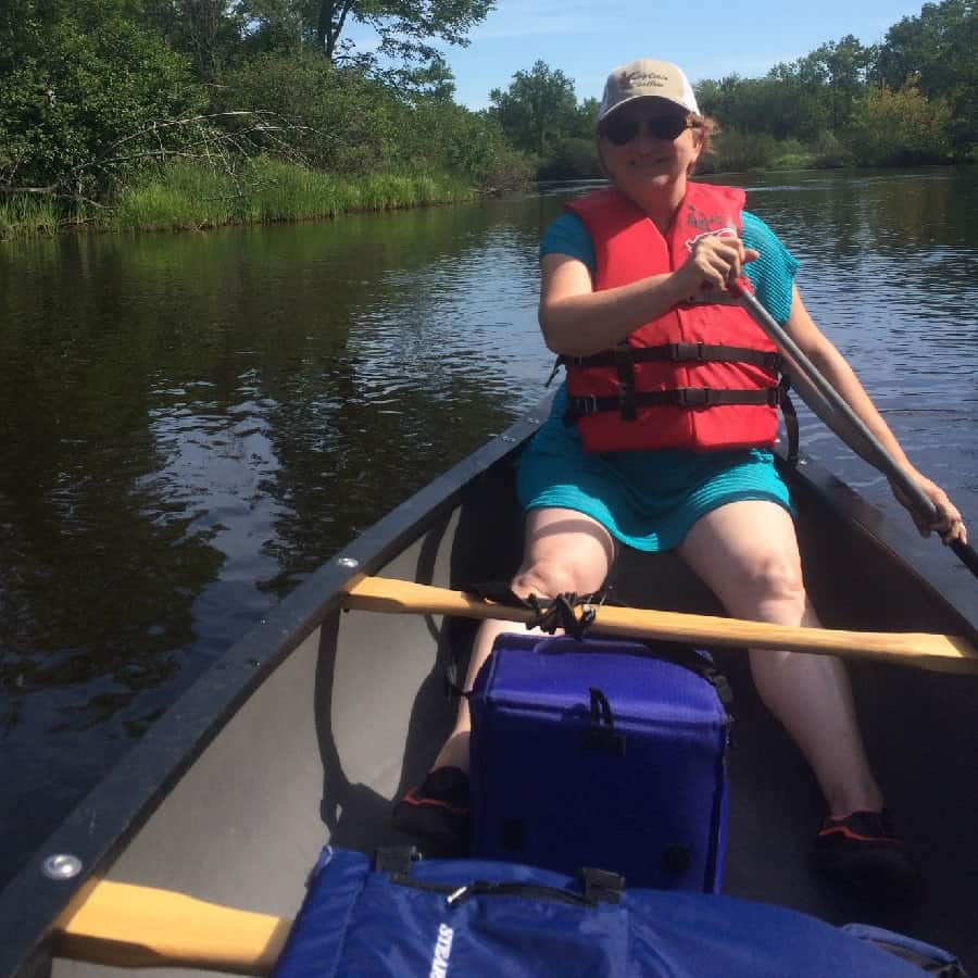 Judi Peterson canoeing the Namekagon River on TWO's trip to Wisconsin this summer.